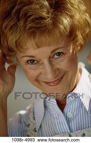 Stock Image - Portrait of a senior woman smiling. Fotosearch