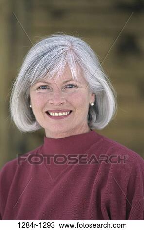 Stock Image - Portrait of a senior woman smiling. Fotosearch
