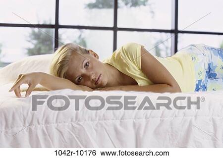 Portrait of a teenage girl lying on View Large Photo Image Stock Photograph - Portrait of a teenage girl lying on. Fotosearch