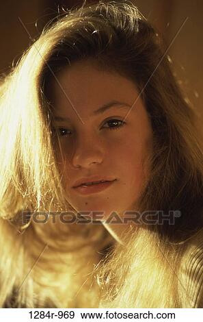 Stock Photo - Portrait of a teenage girl smiling. Fotosearch