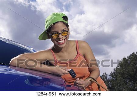 Portrait of a young woman smiling View Large Photo Image Stock Image - Portrait of a young woman smiling. Fotosearch