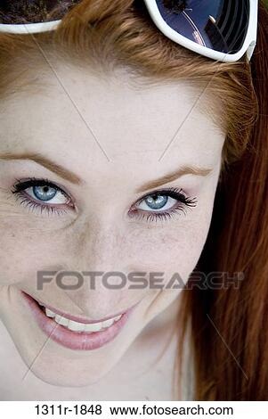 Portrait of a young woman smiling View Large Photo Image Stock Photo - Portrait of a young woman smiling. Fotosearch
