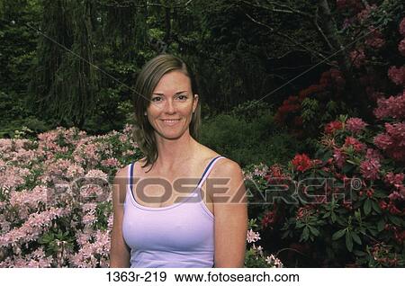 Stock Photo - Portrait of a young woman smiling. Fotosearch