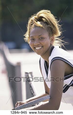 Portrait of a young woman smiling View Large Photo Image Stock Photography - Portrait of a young woman smiling. Fotosearch