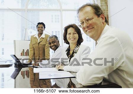 Portrait of business executives in an office View Large Photo Image Stock Photo - Portrait of business executives in an office. Fotosearch