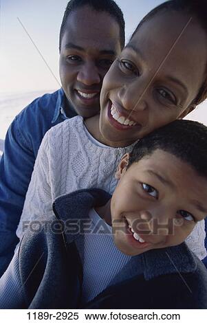 Portrait of parents and their son smiling View Large Photo Image Stock Photography - Portrait of parents and their son smiling. Fotosearch
