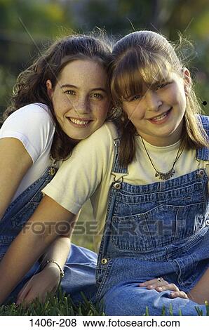 Stock Photo - Portrait of two girls smiling. Fotosearch