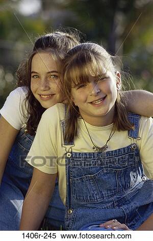 Stock Photography - Portrait of two girls smiling. Fotosearch
