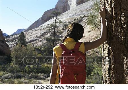 Rear view of a girl with a backpack, Zion National Park, Utah, USA View Large Photo Image Stock Image - Rear view of a girl with a backpack, Zion National Park, Utah, USA. Fotosearch
