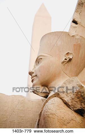 Red sandstone 18th Dynasty Amun and Amunet Dyad statue in the Court of the 6th Pylon at Karnak Temple, Luxor, Egypt View Large Photo Image Stock Photo - Red sandstone 18th Dynasty Amun and Amunet Dyad statue in the Court of the 6th Pylon at Karnak Temple, Luxor, Egypt. Fotosearch