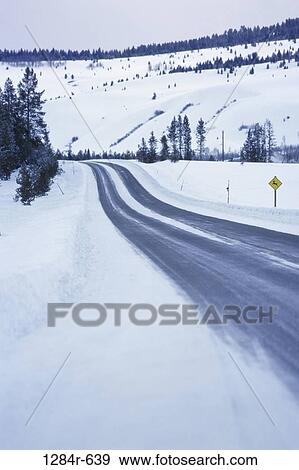 Road passing through a snow covered landscape, Sun Valley, Idaho, USA View Large Photo Image Stock Photo - Road passing through a snow covered landscape, Sun Valley, Idaho, USA. Fotosearch