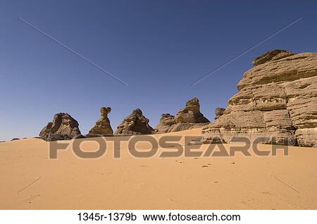 Rock formations in a desert, Tadrart Acacus, Fezzan, Libya View Large Photo Image Stock Image - Rock formations in a desert, Tadrart Acacus, Fezzan, Libya. Fotosearch
