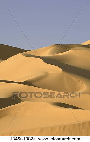 Sand dunes in a desert, Erg Awbari, Fezzan, Libya View Large Photo Image Stock Image - Sand dunes in a desert, Erg Awbari, Fezzan, Libya. Fotosearch