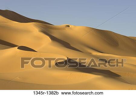 Sand dunes in a desert, Erg Awbari, Fezzan, Libya View Large Photo Image Stock Image - Sand dunes in a desert, Erg Awbari, Fezzan, Libya. Fotosearch
