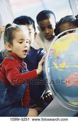 School children looking at a globe View Large Photo Image Stock Image - School children looking at a globe. Fotosearch
