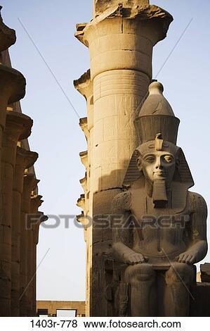 Seated Colossal Statute of Ramses II and Colannade of Amenhotep III, Luxor Temple, Luxor, Egypt View Large Photo Image Stock Photo - Seated Colossal Statute of Ramses II and Colannade of Amenhotep III, Luxor Temple, Luxor, Egypt. Fotosearch