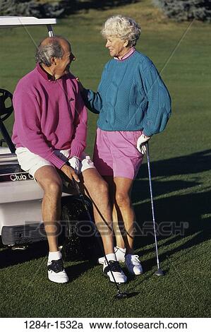 Senior couple at a golf course View Large Photo Image Stock Image - Senior couple at a golf course. Fotosearch