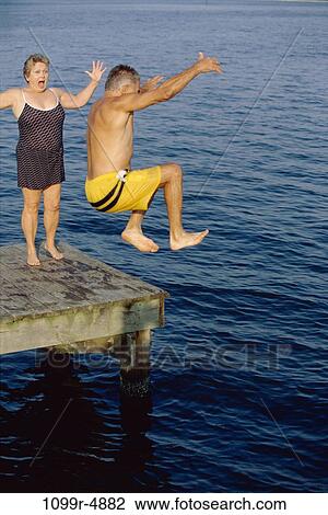 Senior couple at the end of a pier View Large Photo Image Stock Image - Senior couple at the end of a pier. Fotosearch