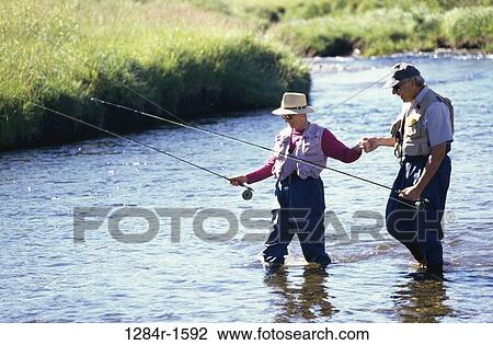Senior couple fishing together in a river, Stanley, Idaho, USA View Large Photo Image Stock Image - Senior couple fishing together in a river, Stanley, Idaho, USA. Fotosearch