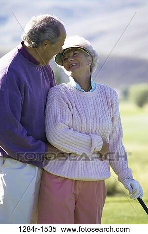 Stock Photography - Senior couple looking at each other. Fotosearch
