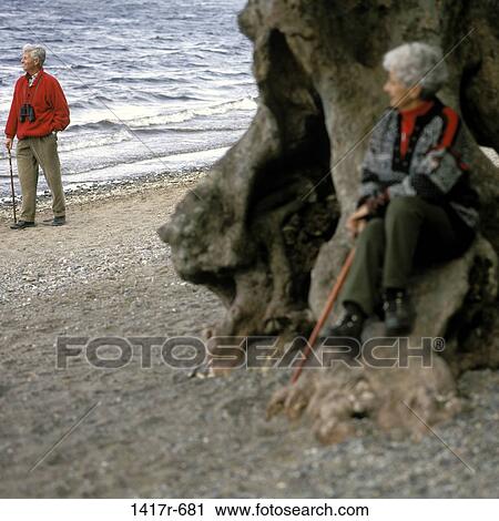 Stock Image - Senior couple on the beach. Fotosearch