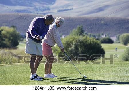 Senior couple playing golf View Large Photo Image Stock Image - Senior couple playing golf. Fotosearch
