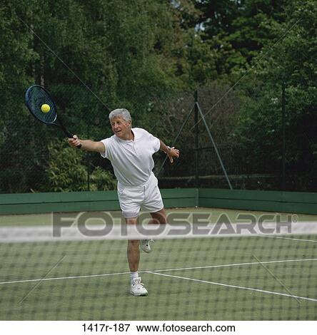 Senior man playing tennis View Large Photo Image Stock Photo - Senior man playing tennis. Fotosearch