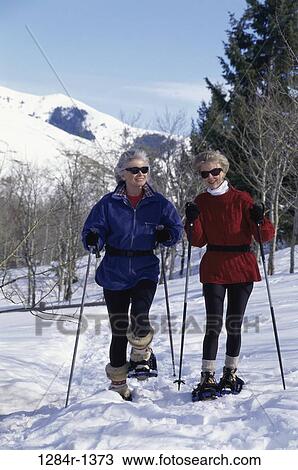 Senior women hiking on snow View Large Photo Image Stock Image - Senior women hiking on snow. Fotosearch