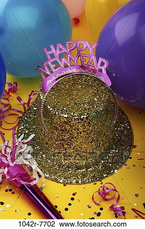 Sequined hat with a Happy New Year sign and streamers with balloons View Large Photo Image Stock Image - Sequined hat with a Happy New Year sign and streamers with balloons. Fotosearch