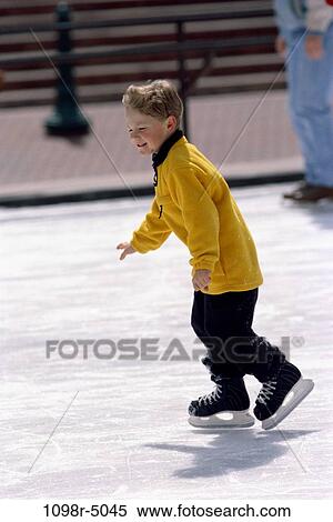 Side profile of a boy ice skating View Large Photo Image Stock Photography - Side profile of a boy ice skating. Fotosearch