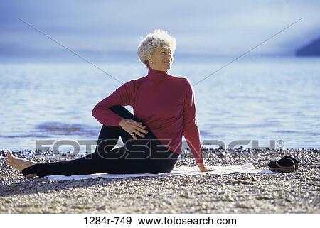 Side profile of a senior woman exercising on the beach View Large Photo Image Stock Photo - Side profile of a senior woman exercising on the beach. Fotosearch