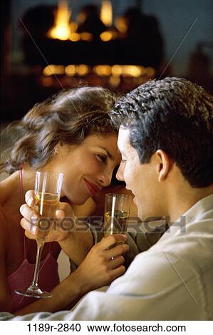 Side profile of a young couple looking at each other View Large Photo Image Stock Image - Side profile of a young couple looking at each other. Fotosearch