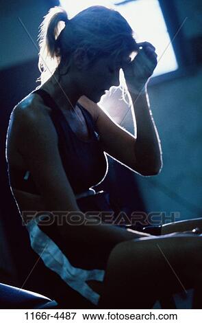 Side profile of a young woman sitting View Large Photo Image Stock Photo - Side profile of a young woman sitting. Fotosearch