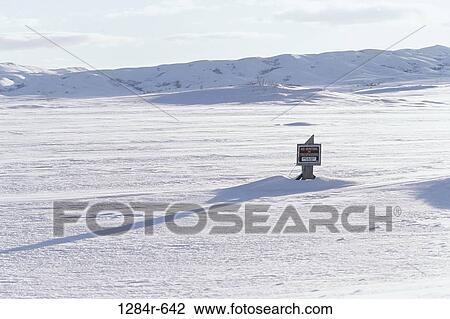Sign in the middle of a snow covered field, Idaho, USA View Large Photo Image Stock Image - Sign in the middle of a snow covered field, Idaho, USA. Fotosearch