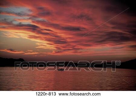 Silhouette of a boat on a lake View Large Photo Image Stock Image - Silhouette of a boat on a lake. Fotosearch