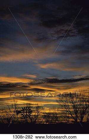 Silhouette of a wind turbine during sunset, Barber, Kansas, USA View Large Photo Image Stock Image - Silhouette of a wind turbine during sunset, Barber, Kansas, USA. Fotosearch