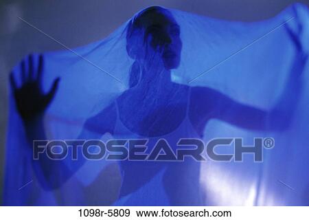 Silhouette of a woman behind a cloth View Large Photo Image Stock Photo - Silhouette of a woman behind a cloth. Fotosearch