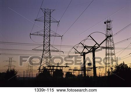 Silhouette of electric power pylons at a power station View Large Photo Image Stock Photography - Silhouette of electric power pylons at a power station. Fotosearch