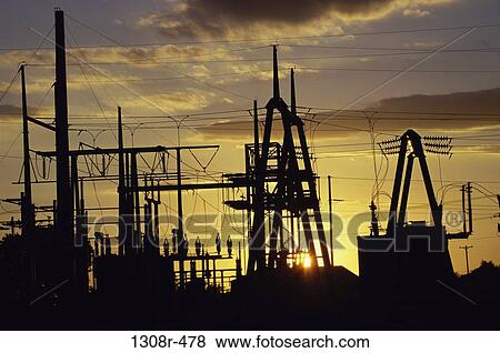 Silhouette of electric power pylons View Large Photo Image Stock Photo - Silhouette of electric power pylons. Fotosearch
