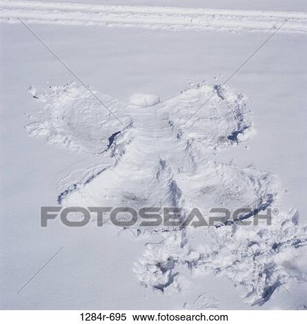Stock Photography - Snow angel on the ground. Fotosearch