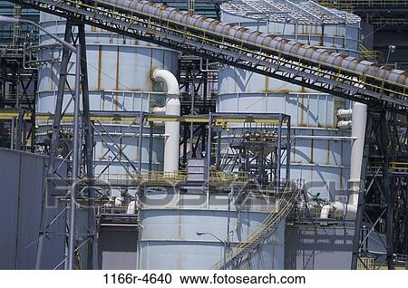 Stock Image - Storage tanks and pipes at a power plant. Fotosearch