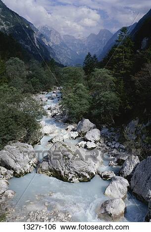 Stream of water flowing down from the mountains, Slovenia View Large Photo Image Stock Photograph - Stream of water flowing down from the mountains, Slovenia. Fotosearch