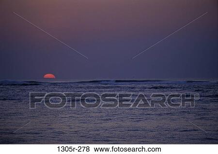 Sunset over the ocean View Large Photo Image Stock Photo - Sunset over the ocean. Fotosearch
