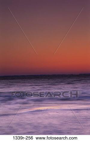Sunset over the ocean View Large Photo Image Stock Photograph - Sunset over the ocean. Fotosearch