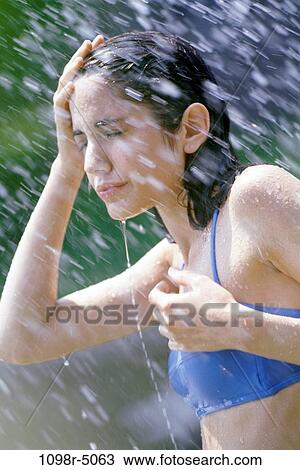 Teenage girl standing in the rain View Large Photo Image Stock Image - Teenage girl standing in the rain. Fotosearch