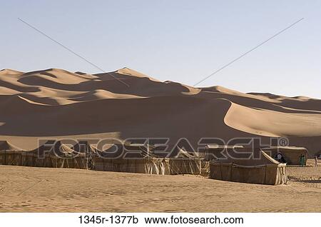 Tents in a desert, Erg Awbari, Fezzan, Libya View Large Photo Image Stock Image - Tents in a desert, Erg Awbari, Fezzan, Libya. Fotosearch