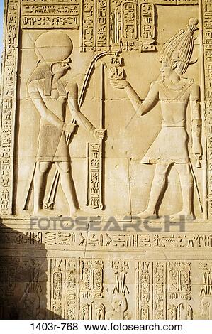 The remarkably preserved carvings at the Temple of Horus and Sobek at the ancient ruins of Kom Ombo on the Nile River in southern Egypt View Large Photo Image Stock Photo - The remarkably preserved carvings at the Temple of Horus and Sobek at the ancient ruins of Kom Ombo on the Nile River in southern Egypt. Fotosearch