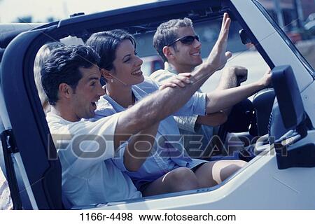 Three young people sitting in a jeep View Large Photo Image Stock Photo - Three young people sitting in a jeep. Fotosearch