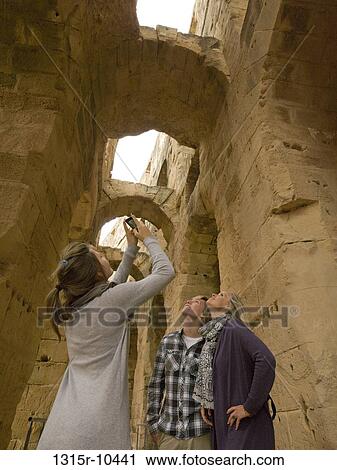 Tunisia, El Djem, Teenage girl taking picture of old ruin View Large Photo Image Stock Image - Tunisia, El Djem, Teenage girl taking picture of old ruin. Fotosearch