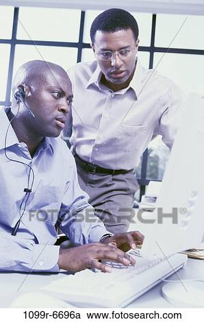 Two businessmen in an office View Large Photo Image Stock Image - Two businessmen in an office. Fotosearch